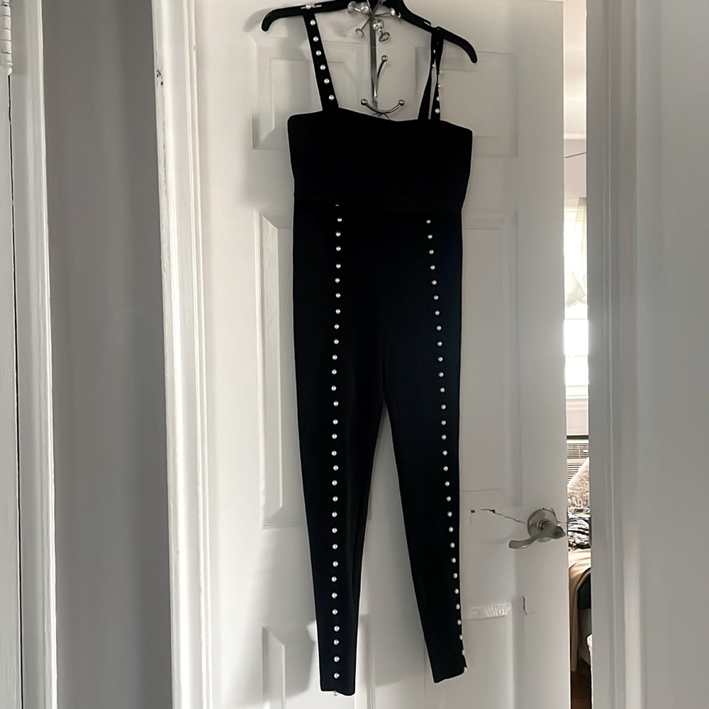 Two-piece  pants set with pearls, going down the leg and the straps of the shirt